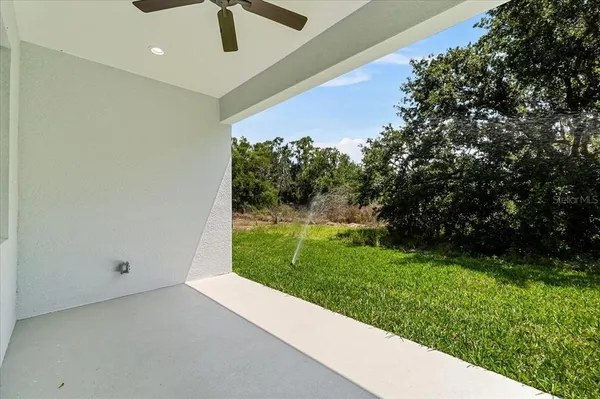 a front view of house with yard and garage