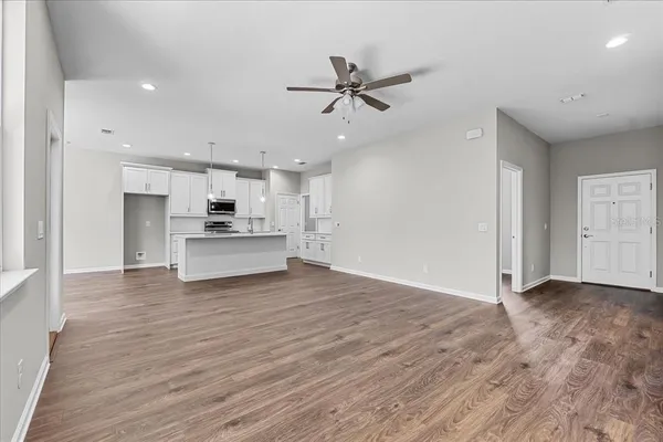 a view of kitchen with wooden floor and window