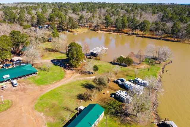 an aerial view of a house with a lake view