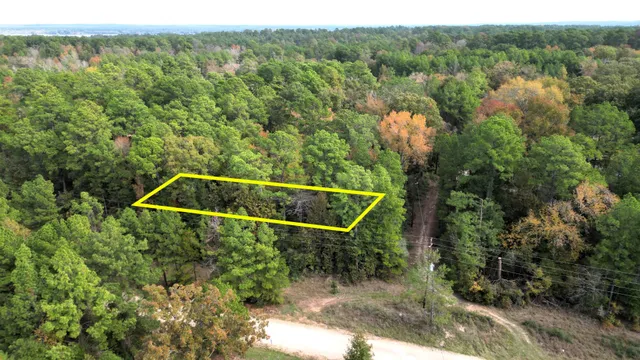 a backyard of a house with lots of green space and outdoor seating