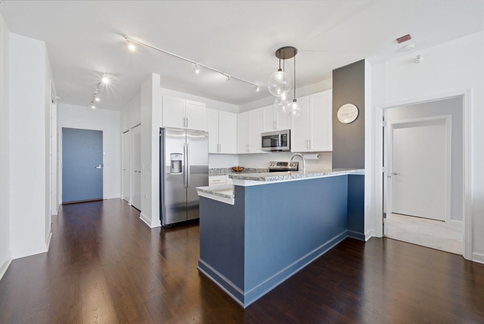 1629 South Prairie Avenue, Unit 2709 Chicago, IL 60616 - Photo 16 of 37 a kitchen with stainless steel appliances granite countertop a refrigerator a sink dishwasher and a stove with wooden floor