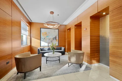 a kitchen with granite countertop stainless steel appliances and view living room