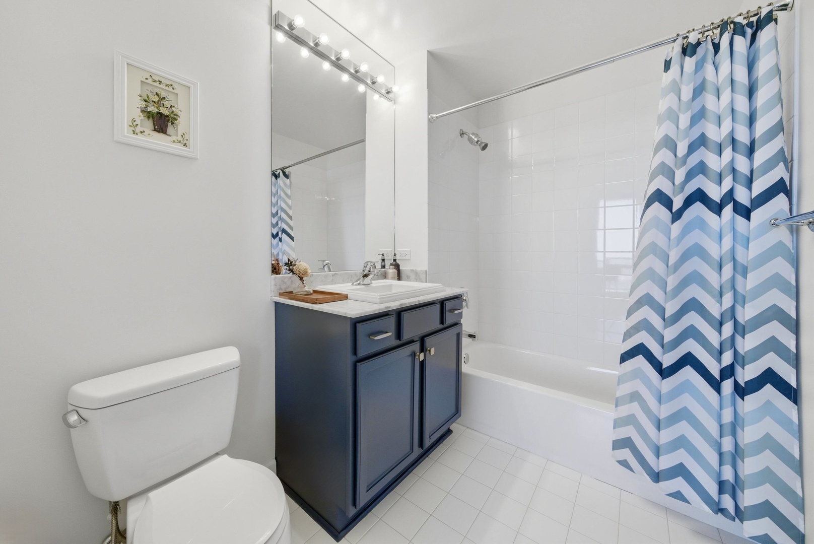 1629 South Prairie Avenue, Unit 2709 Chicago, IL 60616 - Photo 25 of 37 a bathroom with a sink a toilet and shower