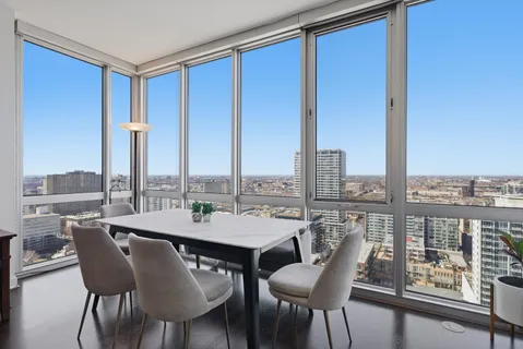 a view of a dining room with furniture window and outside view