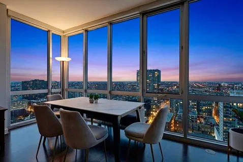 a view of a dining room with furniture and window