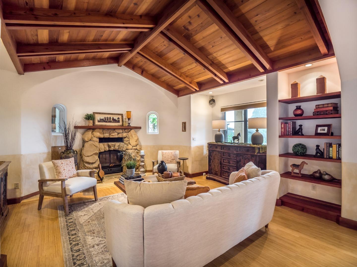 700 Enos Lane Watsonville, CA 95076 - Photo 14 of 56 a living room with furniture a wooden floor and next to a window