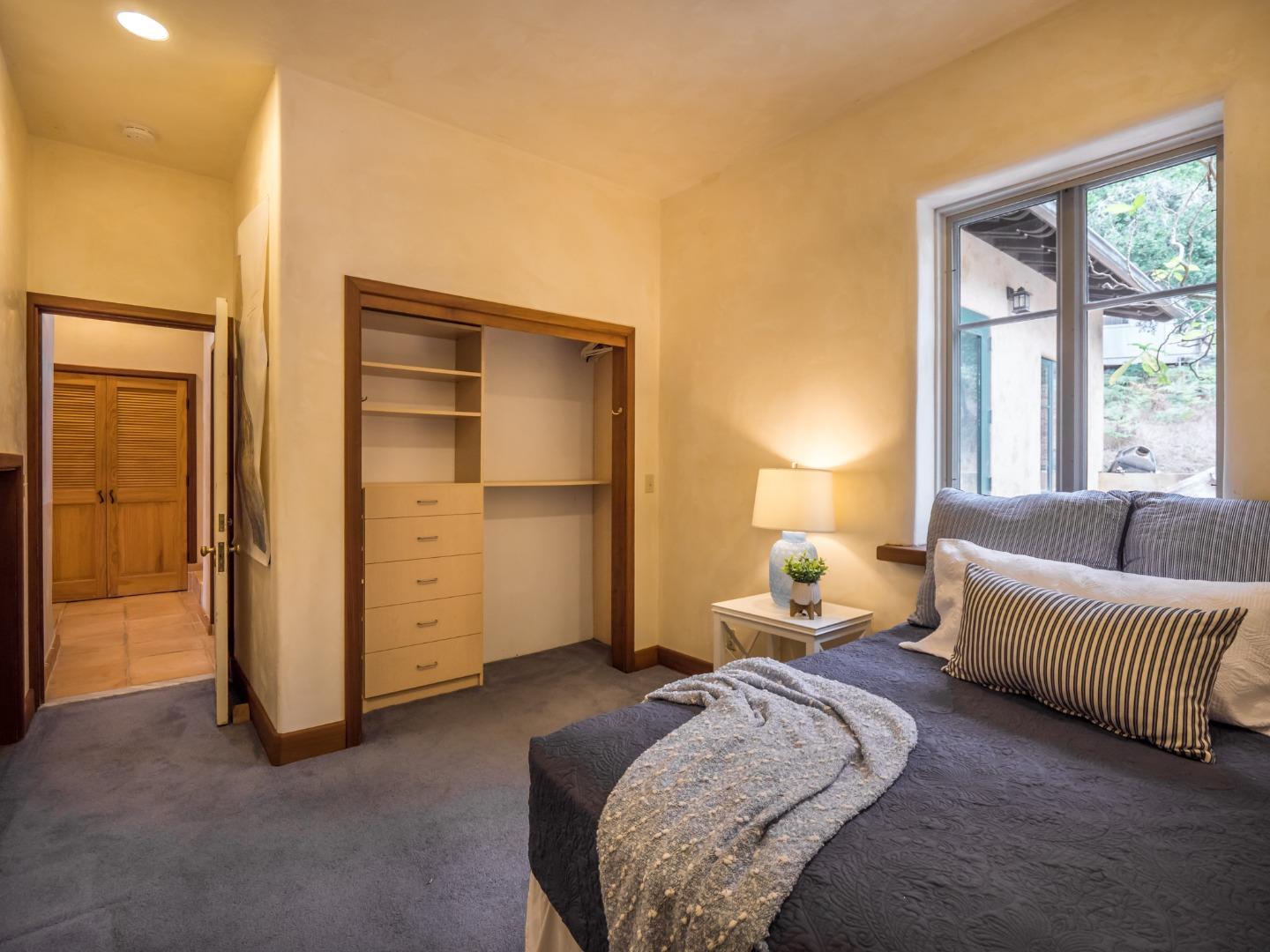 700 Enos Lane Watsonville, CA 95076 - Photo 17 of 56 a bedroom with bed and window