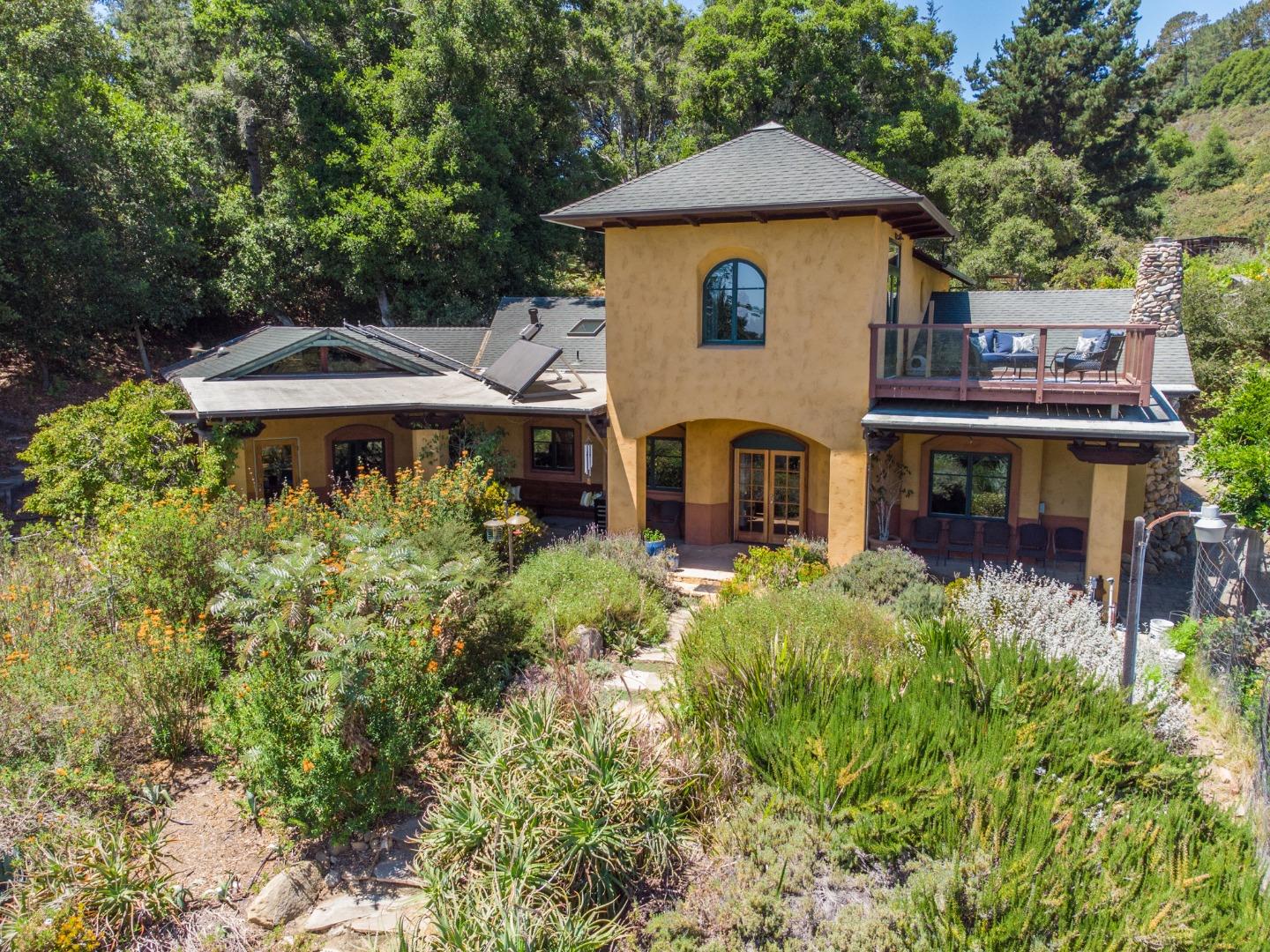 700 Enos Lane Watsonville, CA 95076 - Photo 18 of 56 a front view of a house with a yard and trees