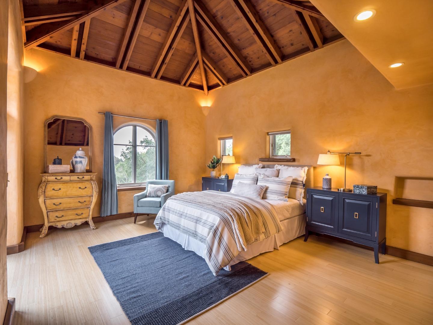 700 Enos Lane Watsonville, CA 95076 - Photo 20 of 56 a bedroom with a bed and wooden floor