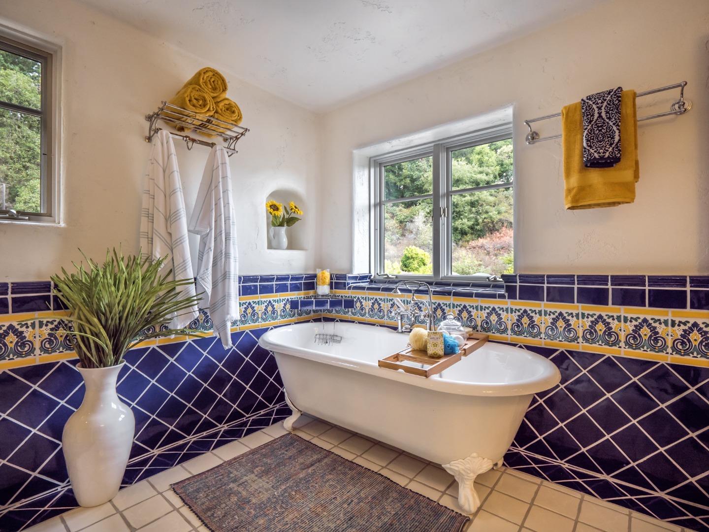 700 Enos Lane Watsonville, CA 95076 - Photo 23 of 56 a spacious bathroom with a tub sink and mirror