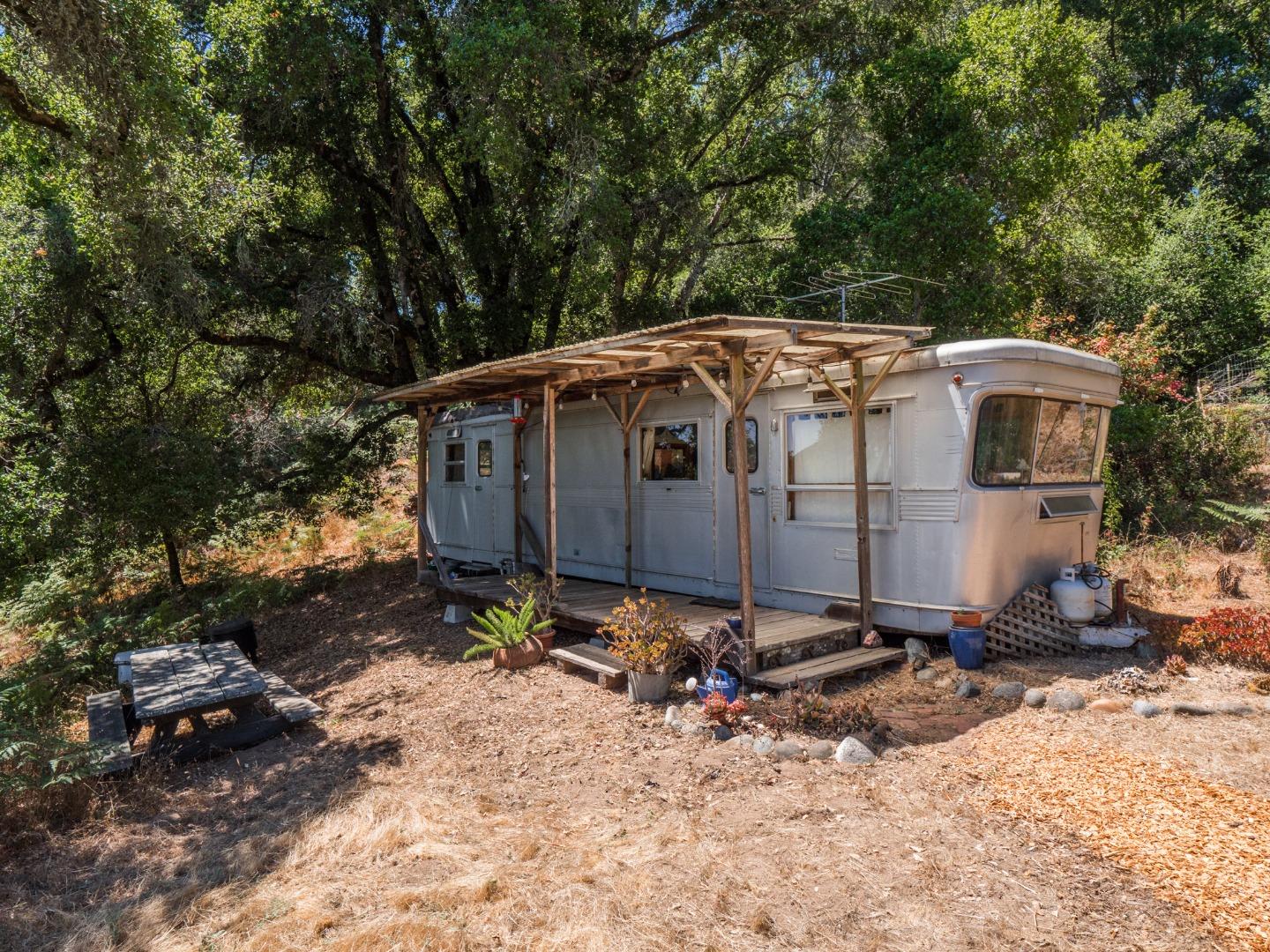 700 Enos Lane Watsonville, CA 95076 - Photo 49 of 56 a view of a small house with yard and sitting area