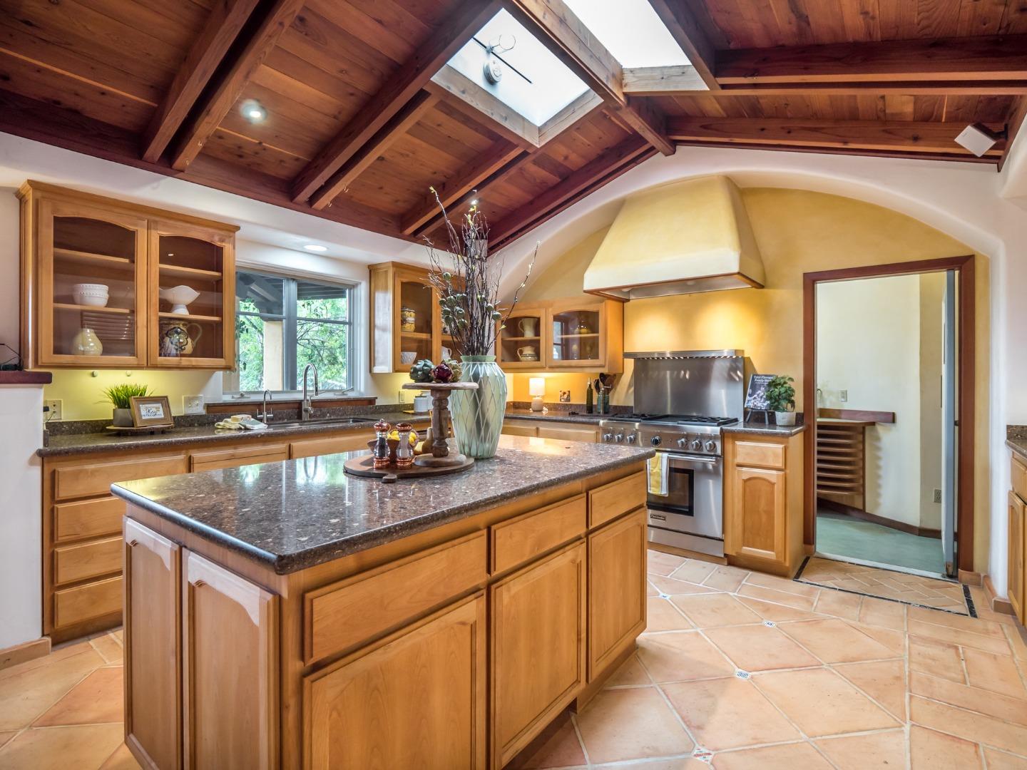 700 Enos Lane Watsonville, CA 95076 - Photo 7 of 56 a kitchen with stainless steel appliances granite countertop a sink a stove and a refrigerator