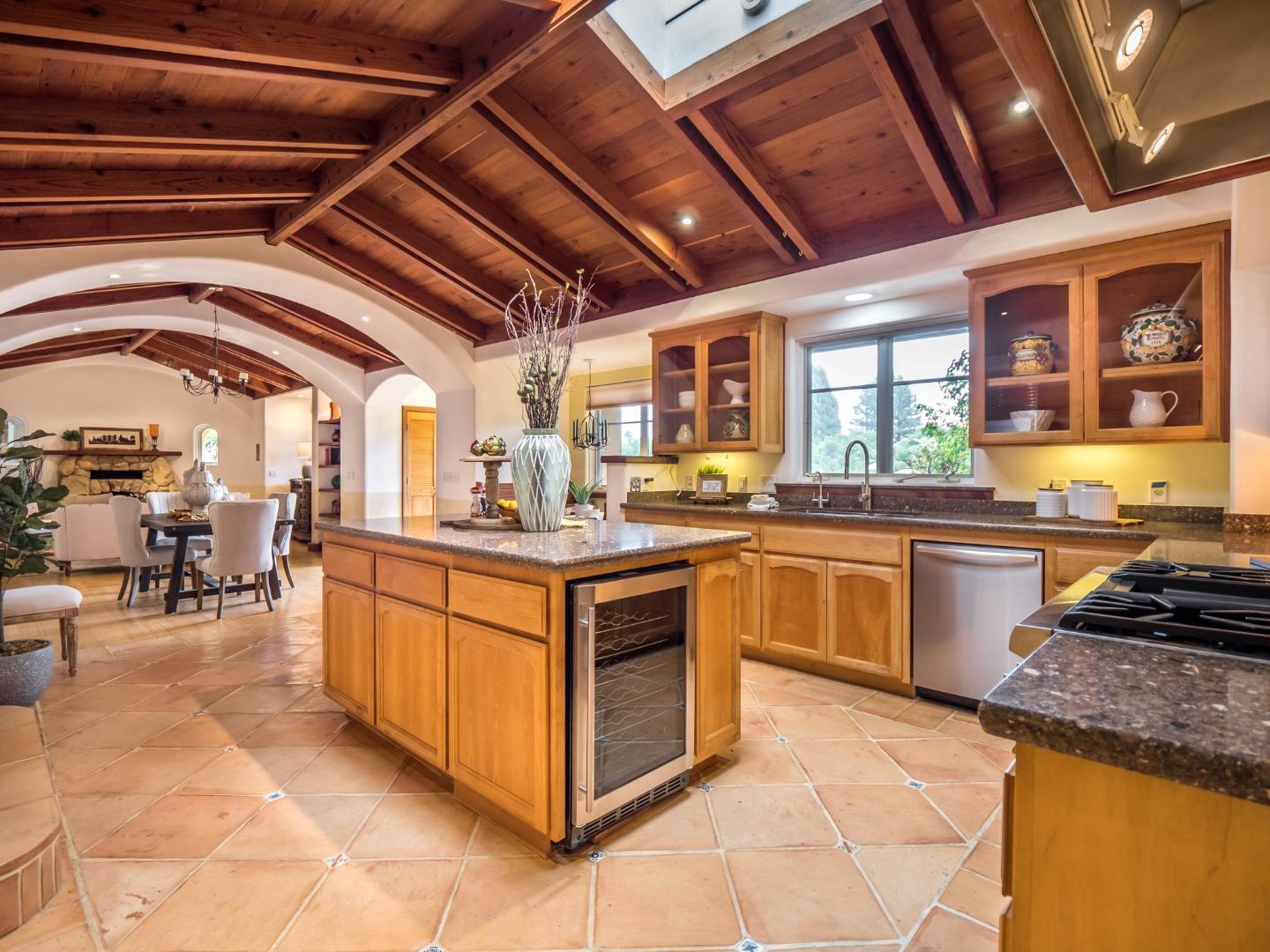 700 Enos Lane Watsonville, CA 95076 - Photo 9 of 56 a kitchen with stainless steel appliances granite countertop a sink and cabinets