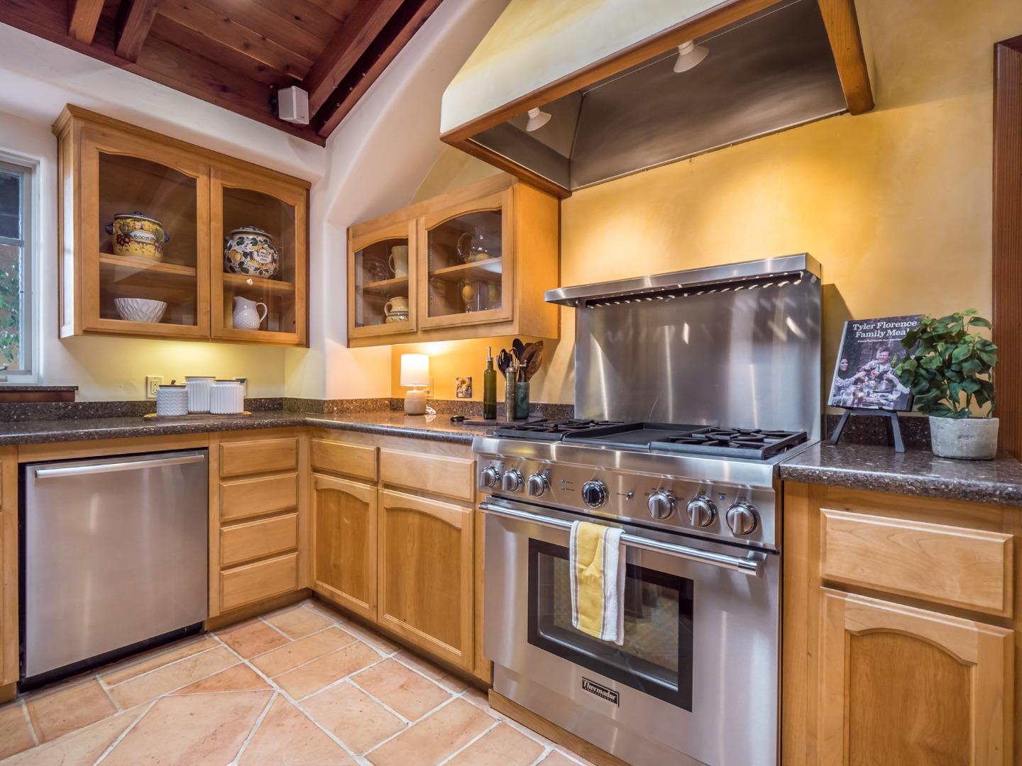 700 Enos Lane Watsonville, CA 95076 - Photo 10 of 56 a kitchen with stainless steel appliances granite countertop a stove and a sink