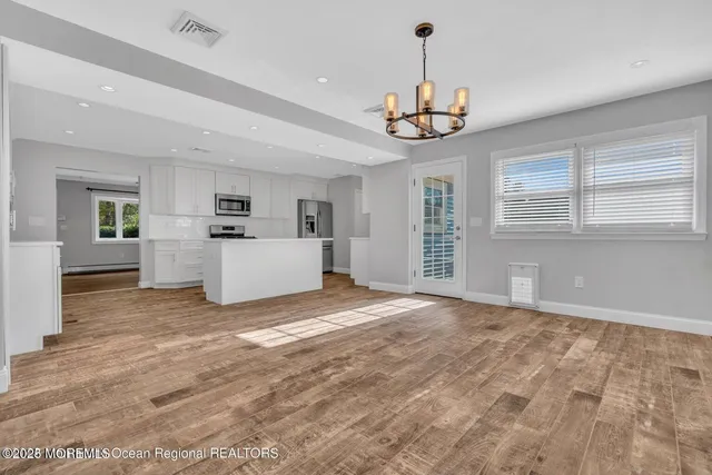 a view of a kitchen with a sink and dishwasher
