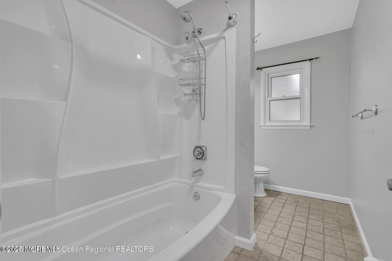 2253 Llewellyn Parkway Forked River, NJ 08731 - Photo 26 of 42 a bathroom with a bathtub and a shower