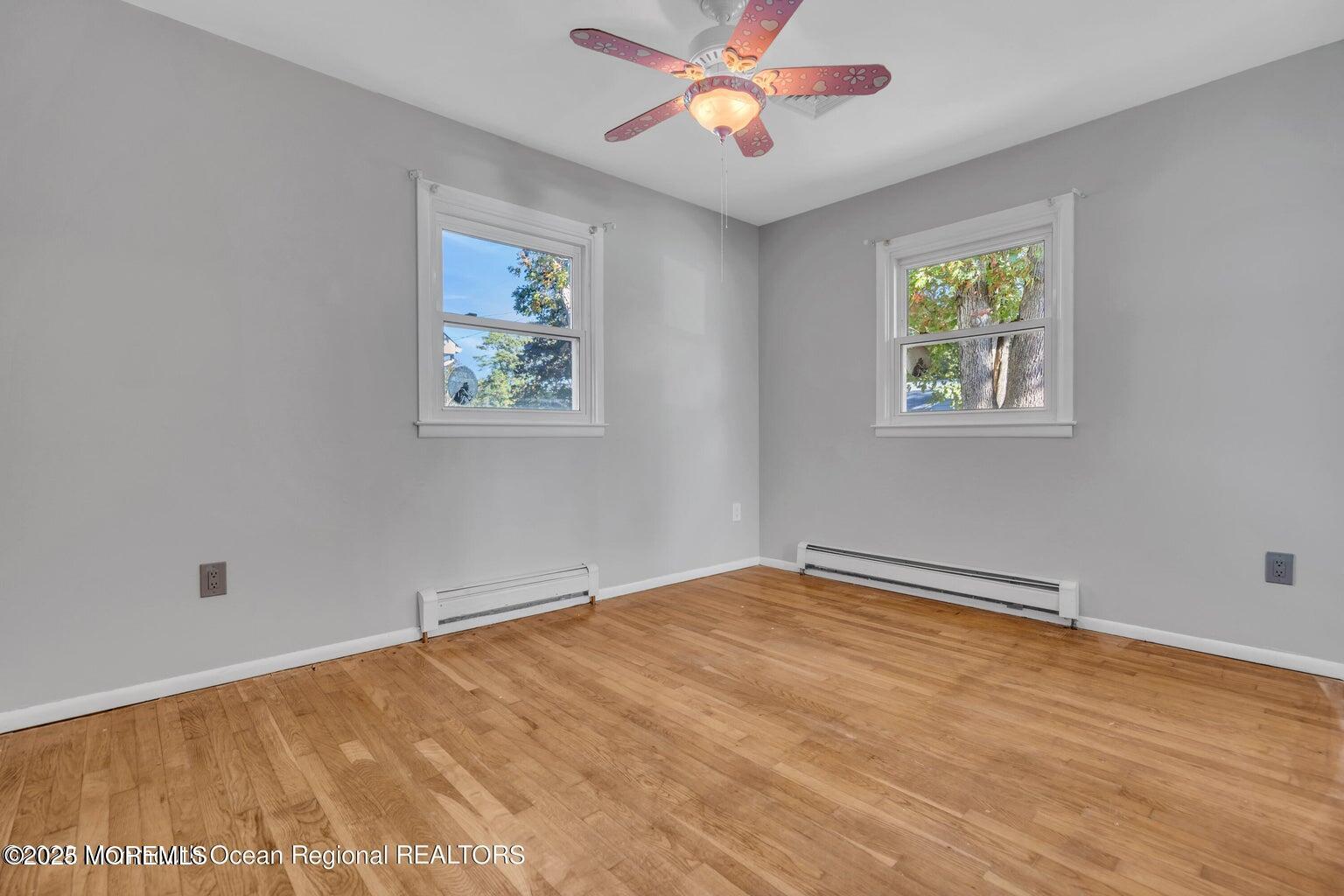 2253 Llewellyn Parkway Forked River, NJ 08731 - Photo 29 of 42 a view of an empty room with window and wooden floor