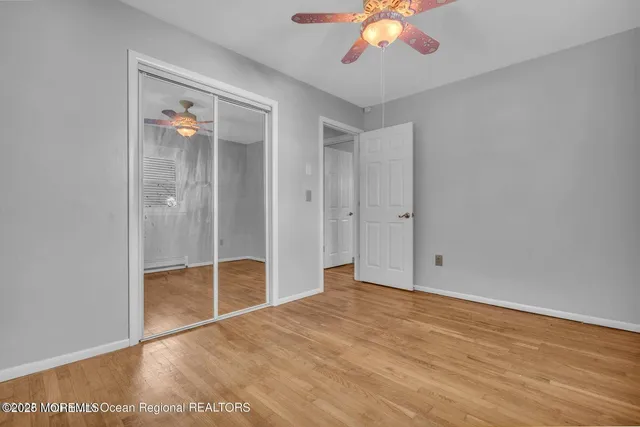 a view of house with backyard and trees