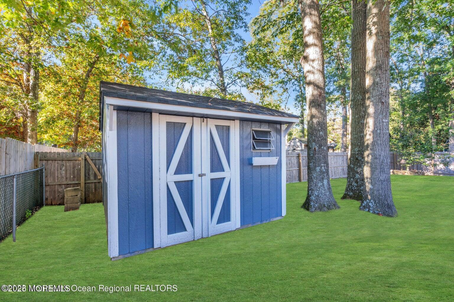 2253 Llewellyn Parkway Forked River, NJ 08731 - Photo 32 of 42 a view of backyard with barn and a large tree