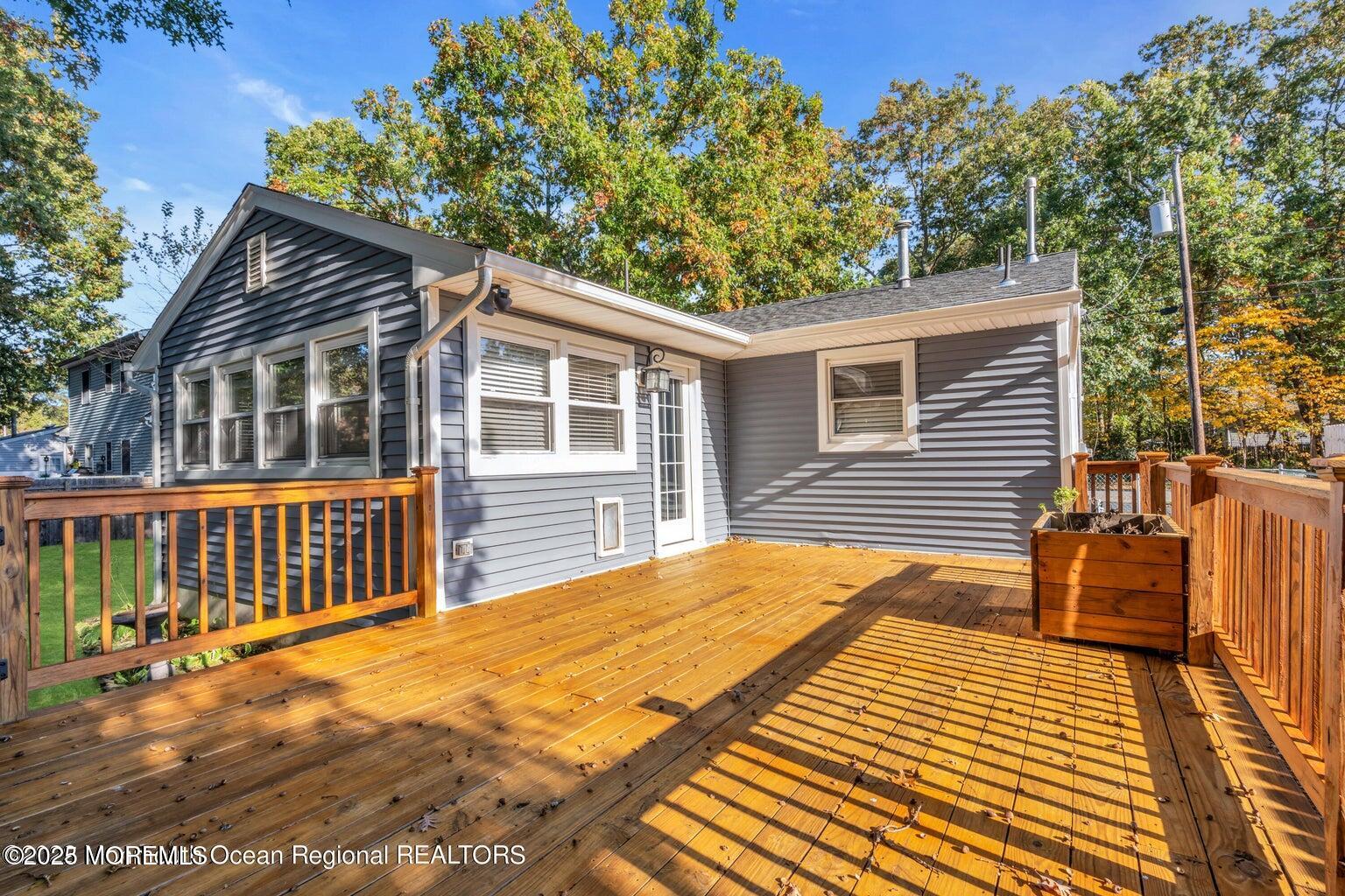 2253 Llewellyn Parkway Forked River, NJ 08731 - Photo 36 of 42 a backyard of a house with wooden deck