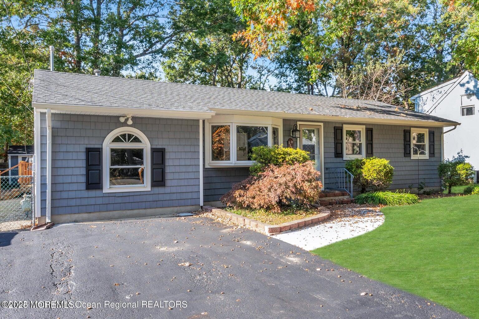 2253 Llewellyn Parkway Forked River, NJ 08731 - Photo 39 of 42 a front view of a house with a yard