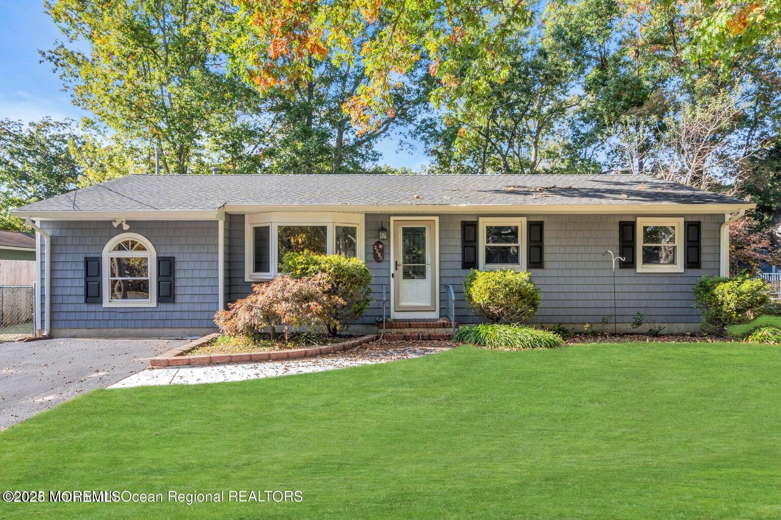 2253 Llewellyn Parkway Forked River, NJ 08731 - Photo 42 of 42 a view of a house with a yard and a garden