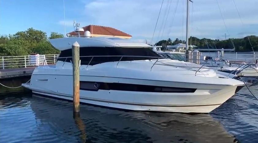 a view of roof deck with table and chairs