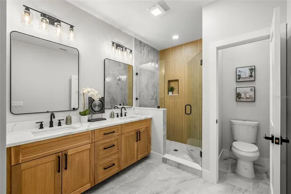 a bathroom with a shower and a sink
