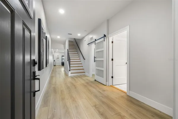 a view of a hallway with stairs