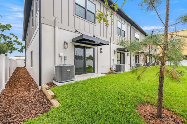 a aerial view of a house with a yard