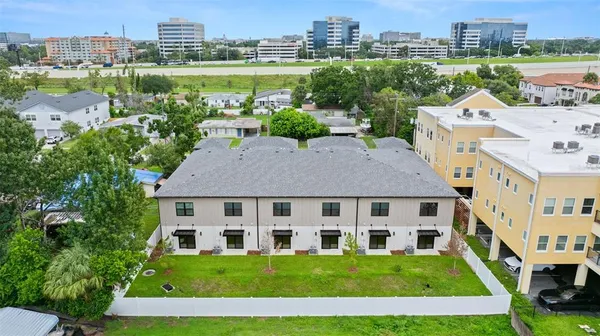 a aerial view of a house with a yard and plants