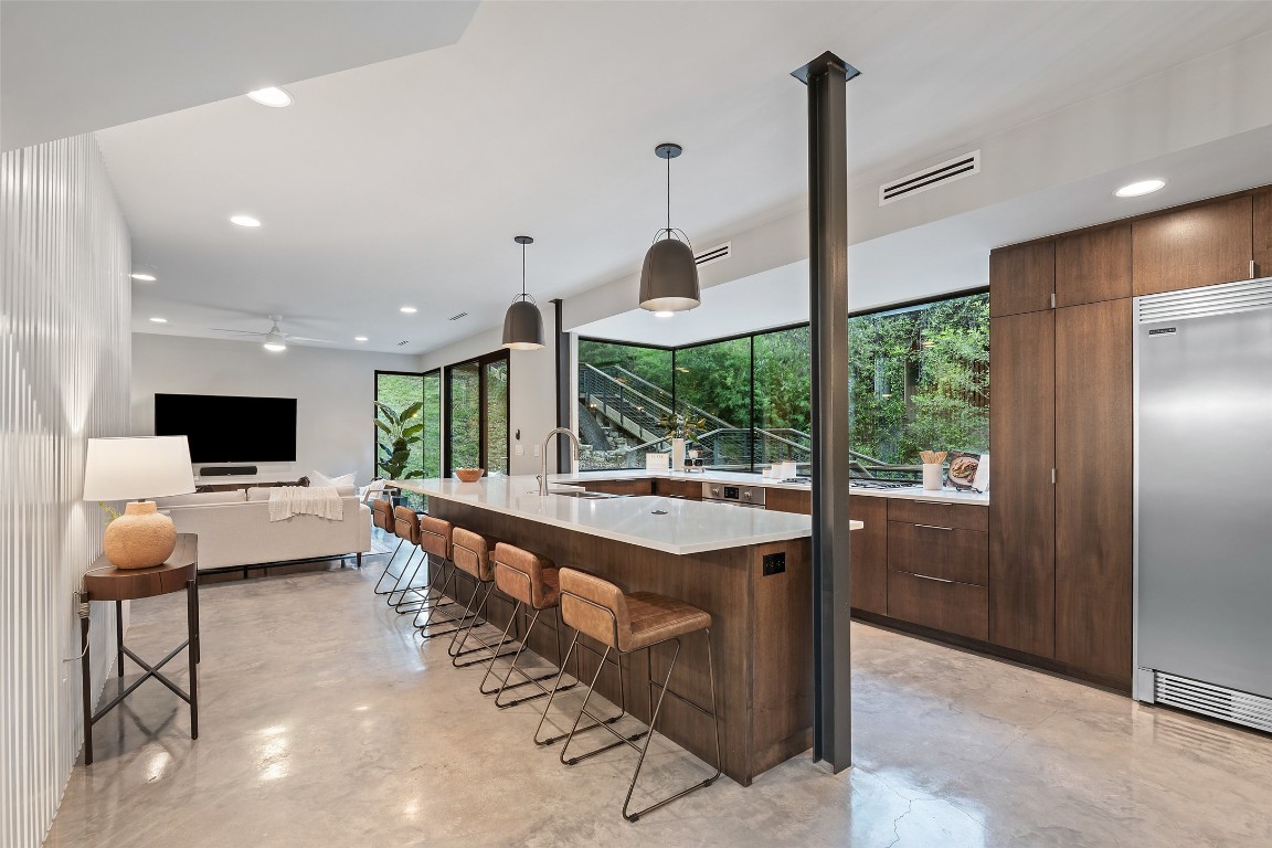 1327 Bonham Terrace, Unit B Austin, TX 78704 - Photo 12 of 40 a large kitchen with a large counter space and appliances