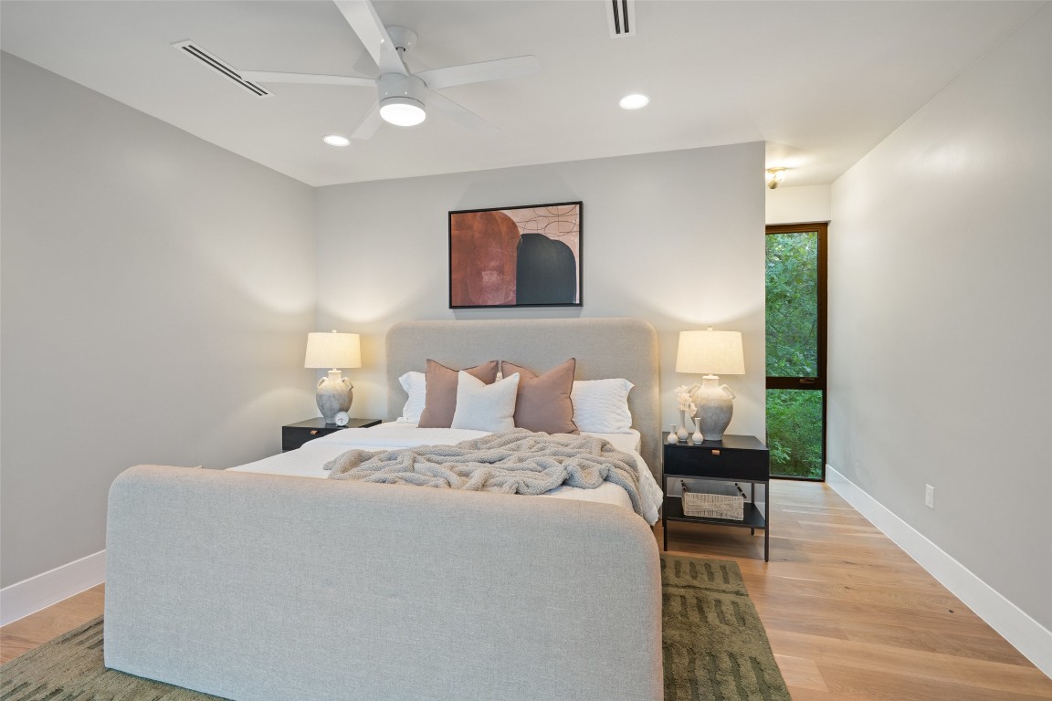 1327 Bonham Terrace, Unit B Austin, TX 78704 - Photo 19 of 40 a bedroom with a bed and a table