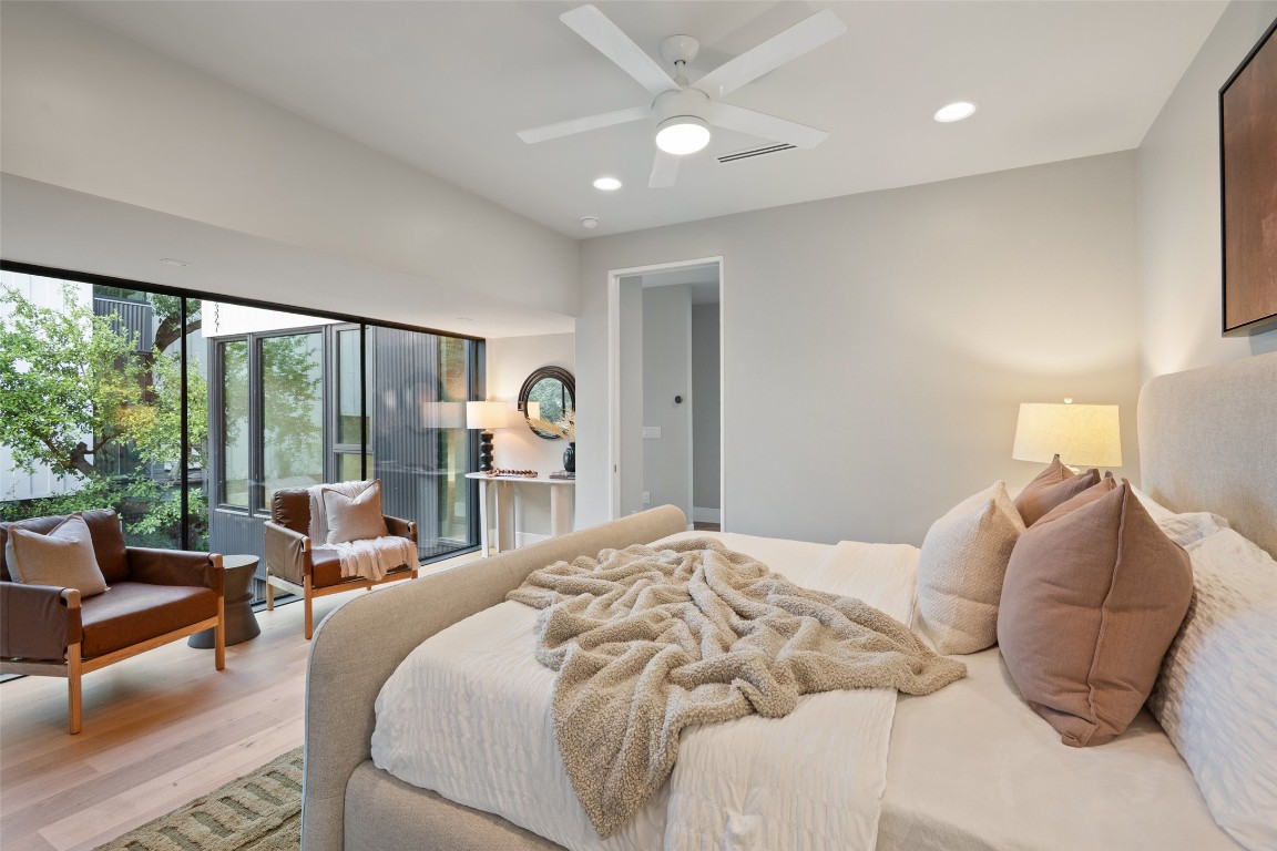 1327 Bonham Terrace, Unit B Austin, TX 78704 - Photo 20 of 40 a bedroom with a large bed and a large window