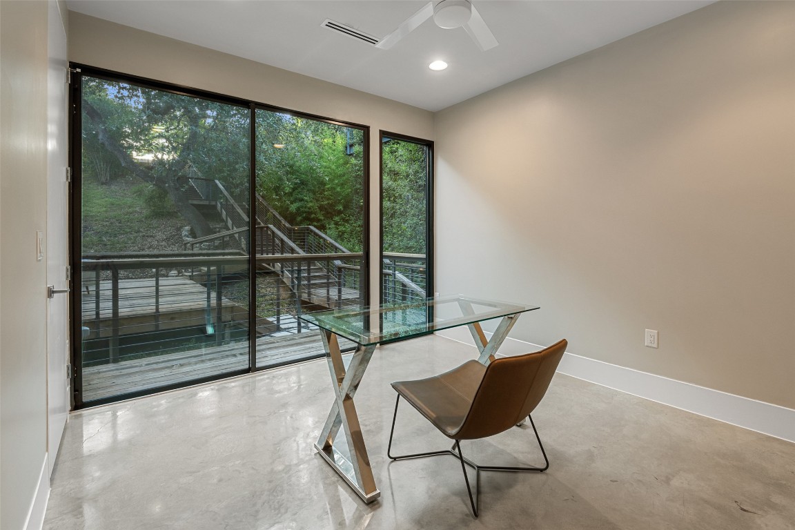 1327 Bonham Terrace, Unit B Austin, TX 78704 - Photo 30 of 40 a view of a room with furniture wooden floor and a window