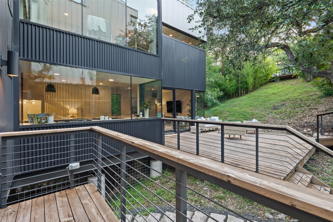 1327 Bonham Terrace, Unit B Austin, TX 78704 - Photo 37 of 40 a view of balcony with floor to ceiling window and wooden floor