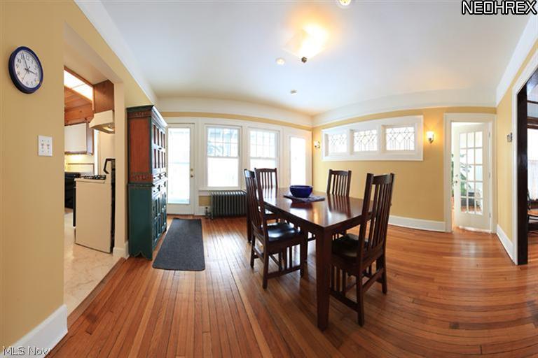 3086 Chadbourne Road Cleveland, OH 44120 - Photo 4 of 25 The panoramic view of this Formal Dining Room highlights this home's gorgeous hardwood flooring and measures 15x13. Greeted by romantic sconces and cheery windows, this airy room is perfect for entertaining! This room also opens to a large deck and a private, fenced rear yard. In addition, French doors act as a grand entrance into the Sun Room!
