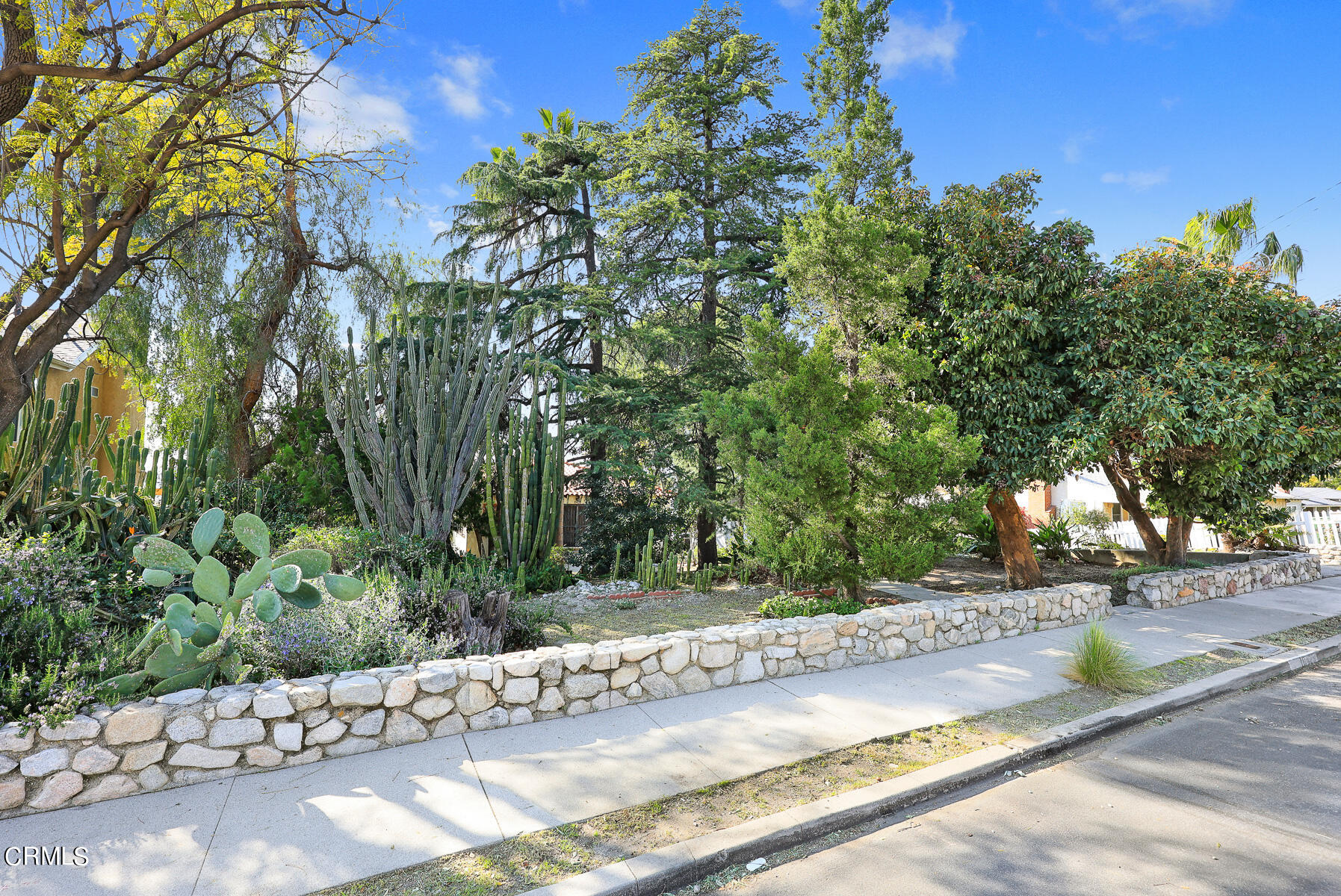 10425 Pinyon Avenue Tujunga, CA 91042 - Photo 2 of 6 a view of a street with a tree