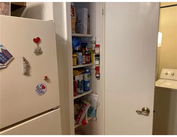 a view of storage and utility room with washer and dryer
