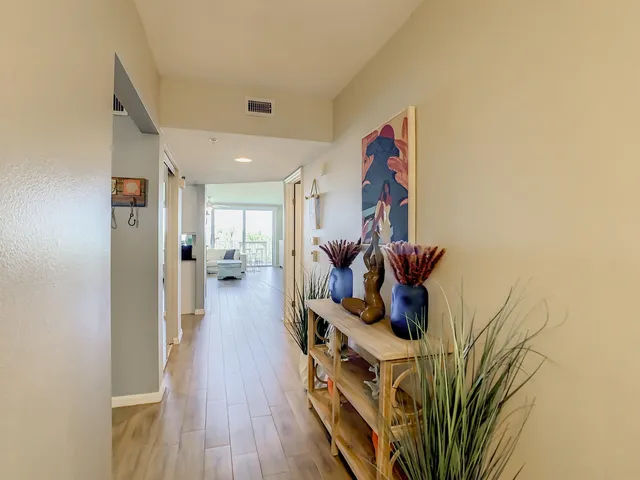 a kitchen with stainless steel appliances granite countertop a stove a sink and a granite counter tops with white cabinets
