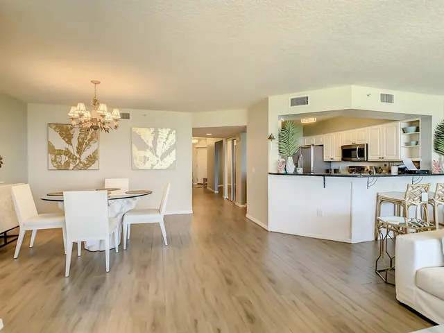 a view of a hallway view with wooden floor and furniture