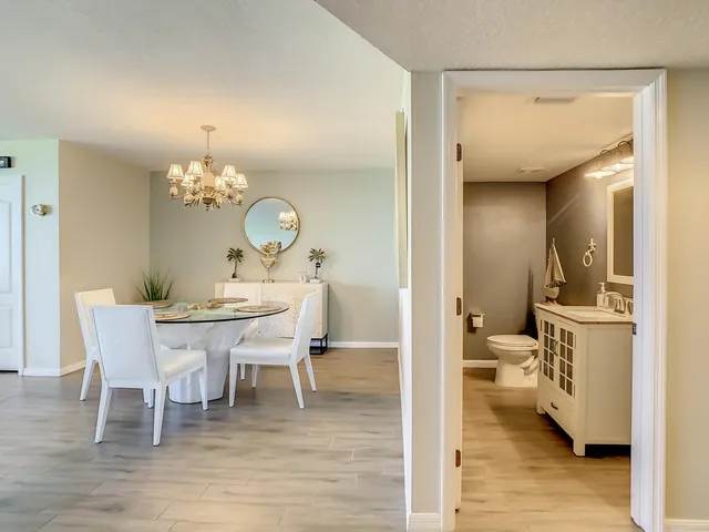 a spacious bedroom with a bed and a flat screen tv