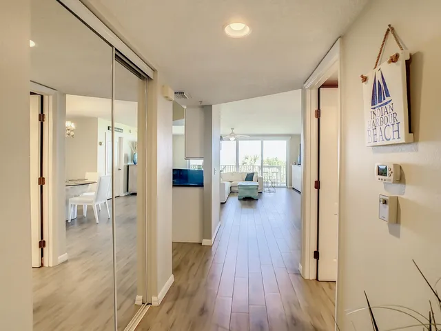 a view of an entryway with wooden floor