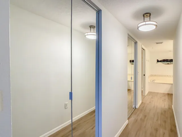 an aerial view of a house with a garden and lake view