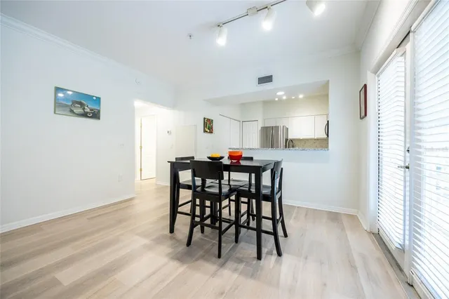 a kitchen with a refrigerator a sink and cabinets