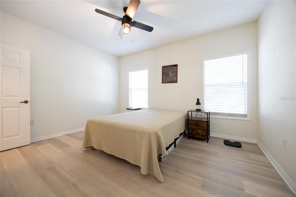 4850 Southwest 91 Terrace, Unit P201 Gainesville, FL 32608 - Photo 20 of 33 a bedroom with a bed and a window