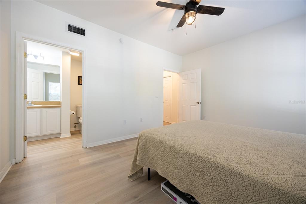 4850 Southwest 91 Terrace, Unit P201 Gainesville, FL 32608 - Photo 21 of 33 a bedroom with a bed and with furniture