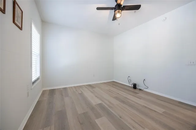 a bathroom with a toilet and a shower curtain