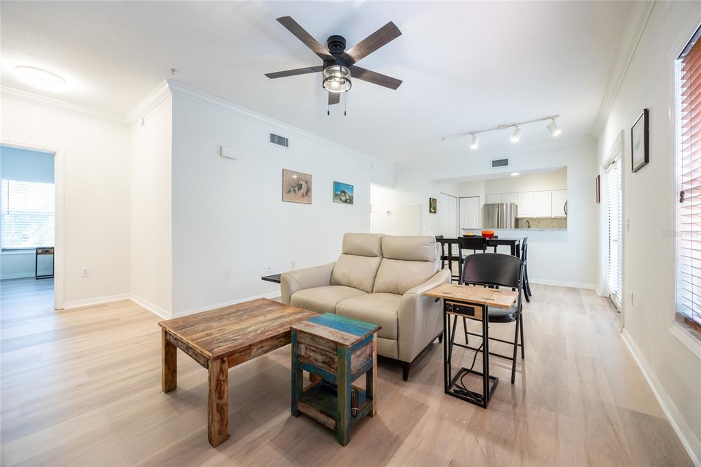 4850 Southwest 91 Terrace, Unit P201 Gainesville, FL 32608 - Photo 8 of 33 a living room with furniture and a wooden floor