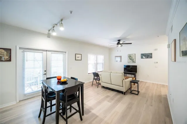 a view of a dining room with furniture and wooden floor